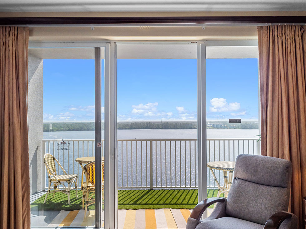 Private balconies with sunrise views over Lake Bryan.